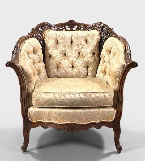 Appraisal: Rococo-Style Carved and Walnut-Stained Armchair of generous proportions with an