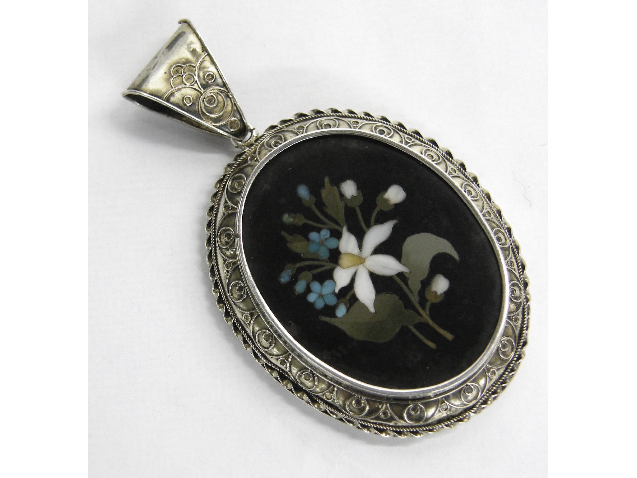 Appraisal: Pietra dura oval floral white metal pendant with wirework decoration