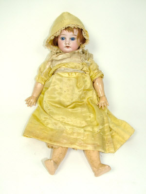 Appraisal: An Armand Marseilles bisque headed doll with jointed wooden limbs