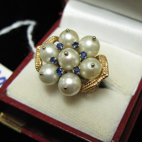 Appraisal: PEARL BLUE SAPPHIRE AND FOURTEEN KARAT GOLD CLUSTER RING set