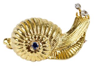 Appraisal: kt Snail Brooch with one round faceted sapphire approx mm