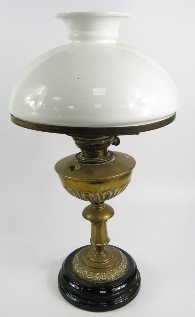 Appraisal: A Veritas brass oil lamp semi fluted reservoir raised on