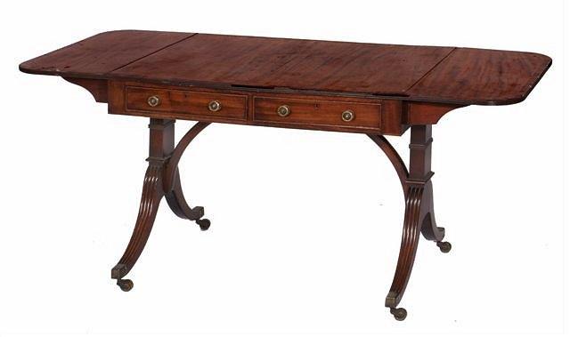 Appraisal: A REGENCY MAHOGANY AND ROSEWOOD BANDED SOFA TABLE the flaps