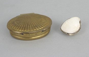 Appraisal: Two Shell Motif Boxes Containing an oval brass box with