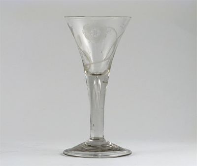 Appraisal: A Jacobite-style wine glass the flared bowl engraved with a