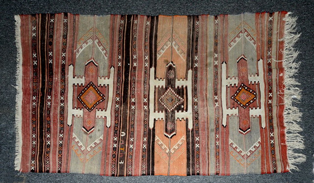 Appraisal: A KELIM PALE POLYCHROME RUG with three medallions x