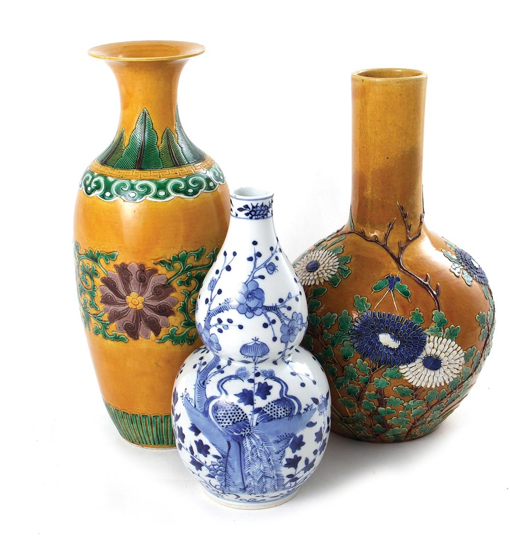 Appraisal: Chinese ceramic vases Qing dynasty comprising yellow-ground green and aubergine-enameled