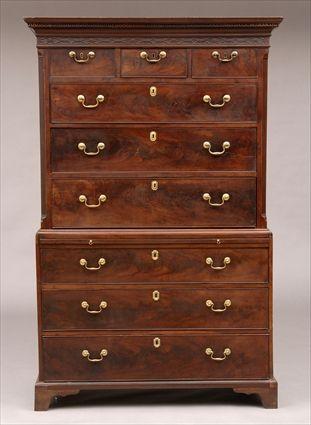 Appraisal: GEORGE III MAHOGANY CHEST ON CHEST The greek key carved