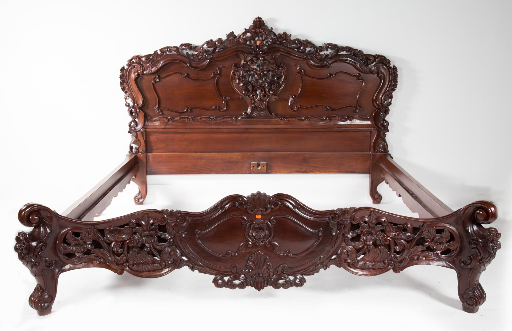 Appraisal: Rococo Revival style carved mahogany king-size bed th century foliated