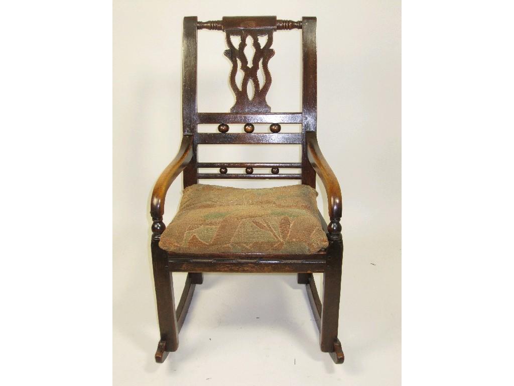 Appraisal: A th Century Child's Rocking Chair pierced back splat on