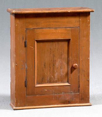 Appraisal: Pine paneled hanging cupboard single door and shelved interior traces