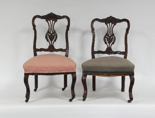 Appraisal: A pair of Victorian nursing chairs with carved splat backs