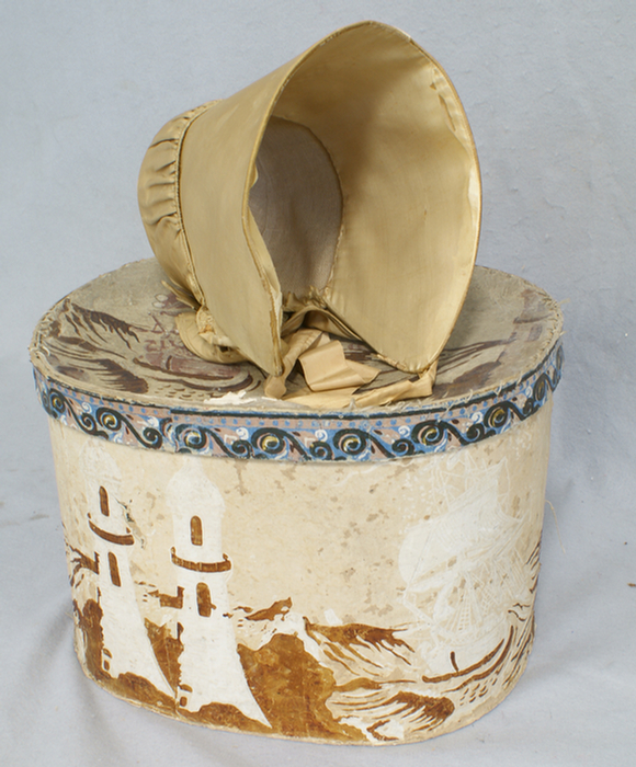 Appraisal: Wallpaper hat box with an early womans bonnet losses to