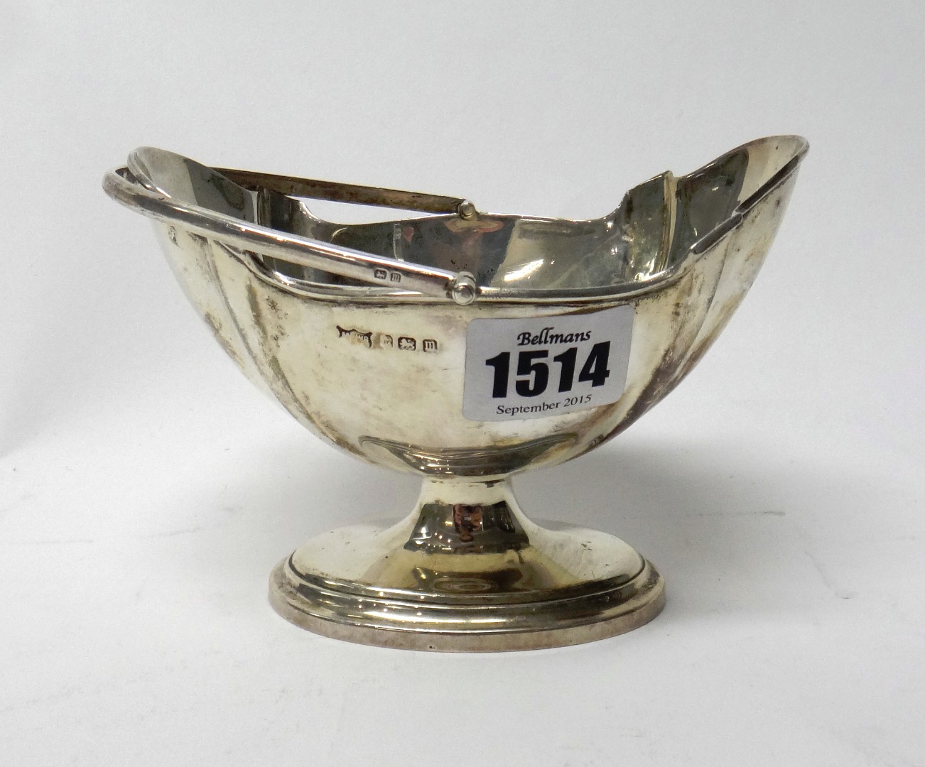 Appraisal: A silver cream pail of shaped oval form with a