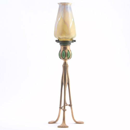 Appraisal: TIFFANY STUDIOS Bronze and glass candlestick lamp with tripod base