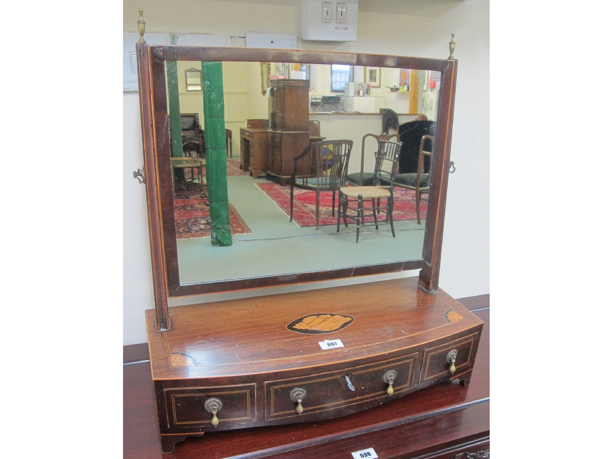 Appraisal: A Victorian mahogany shell inlaid dressing table mirror