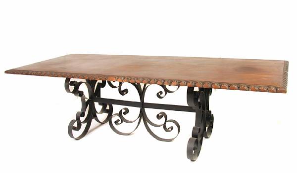 Appraisal: A Spanish Baroque style dining table with wrought iron base