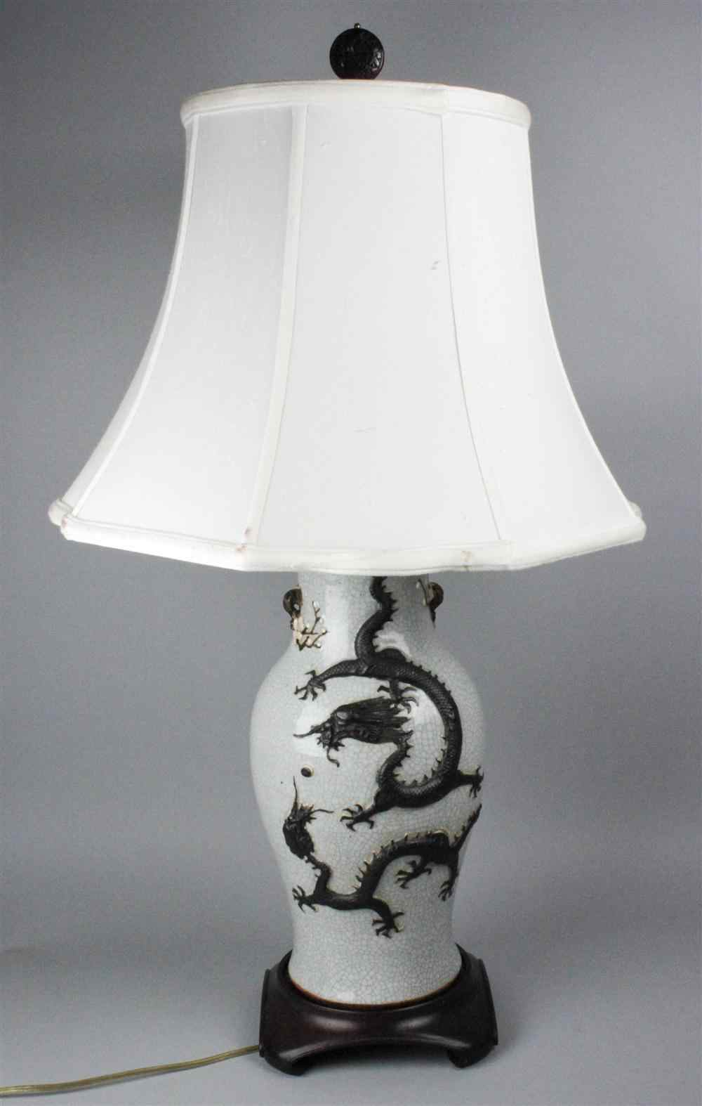 Appraisal: CHINESE CERAMIC VASE oviform with applied dragon and flowering prunus