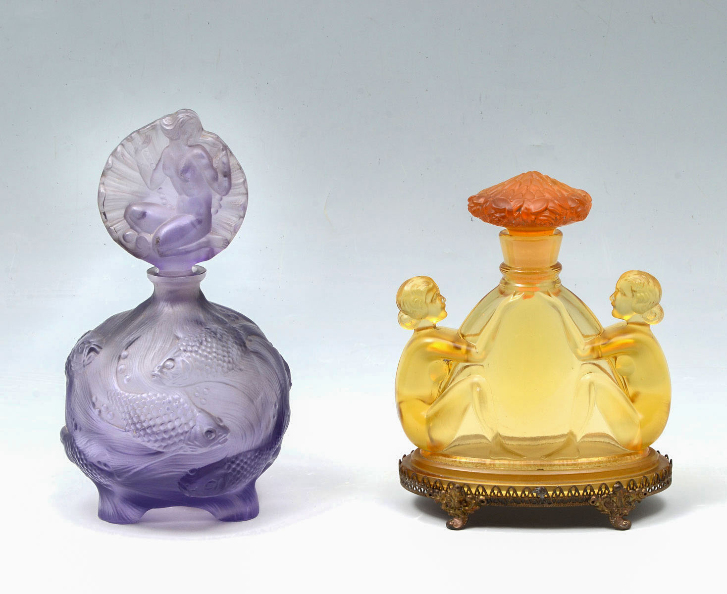 Appraisal: CZECH AMBER NUDE CURT SCHLEVOGT CO PERFUME BOTTLES l s