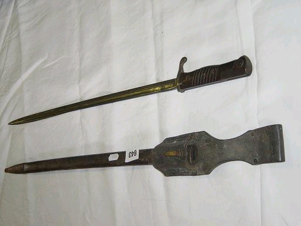 Appraisal: A German model bayonet and leather scabbard