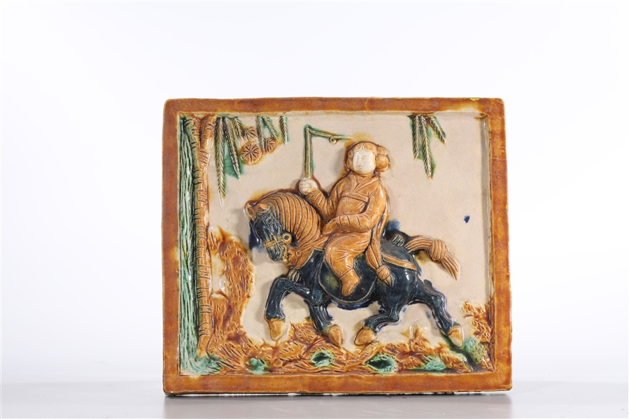 Appraisal: Chinese Sancai-style glazed ceramic plaque of a horse and rider