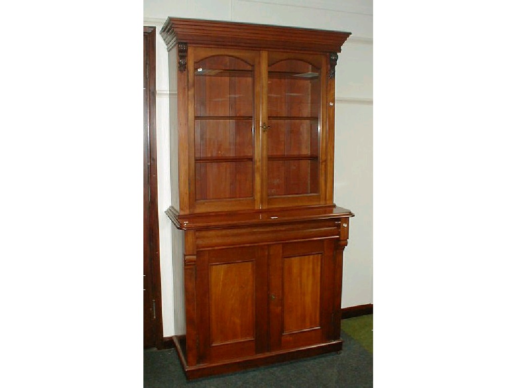 Appraisal: A Victorian mahogany cabinet bookcase with later moulded cornice two