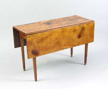 Appraisal: An American Maple Dropleaf Table An American maple dropleaf table