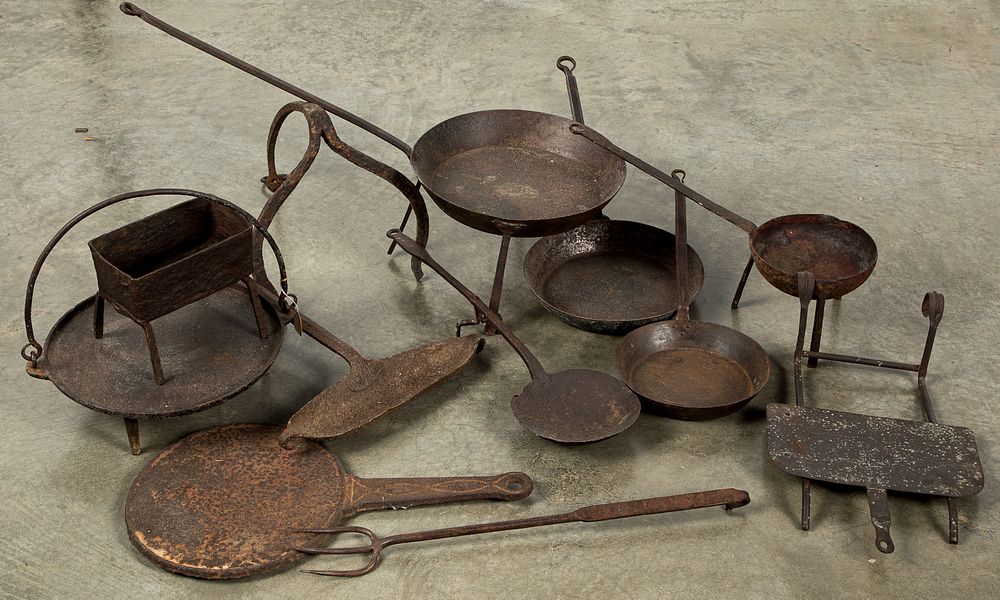 Appraisal: Group of iron kitchenware Group of iron kitchenware to include