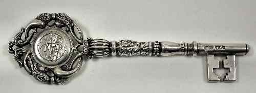 Appraisal: An Edward VII silver presentation key with pierced and scrolled