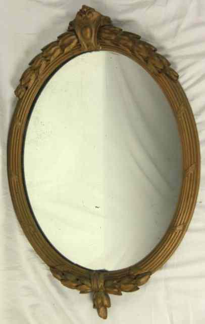 Appraisal: A th Century carved and gilded oval wall mirror cm