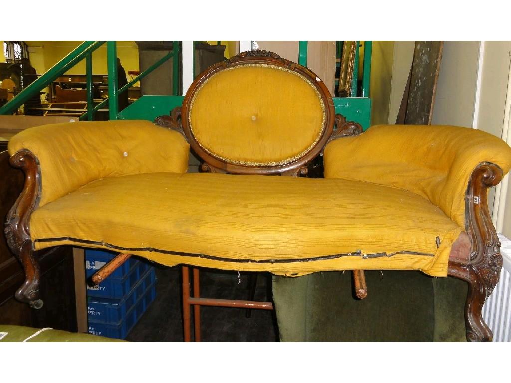 Appraisal: A Victorian sofa with serpentine upholstered seat and arms and