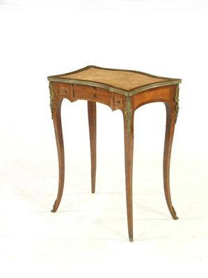 Appraisal: A th century kingwood and brass mounted table of shaped