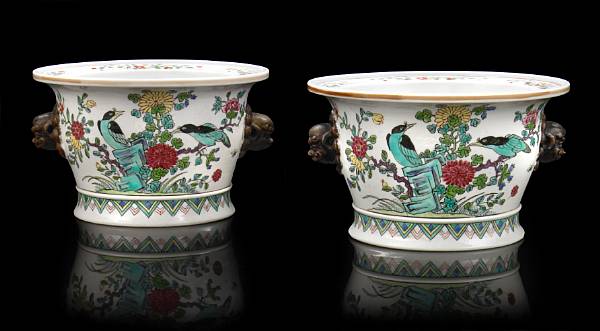 Appraisal: A pair of French porcelain famille rose cache pots probably