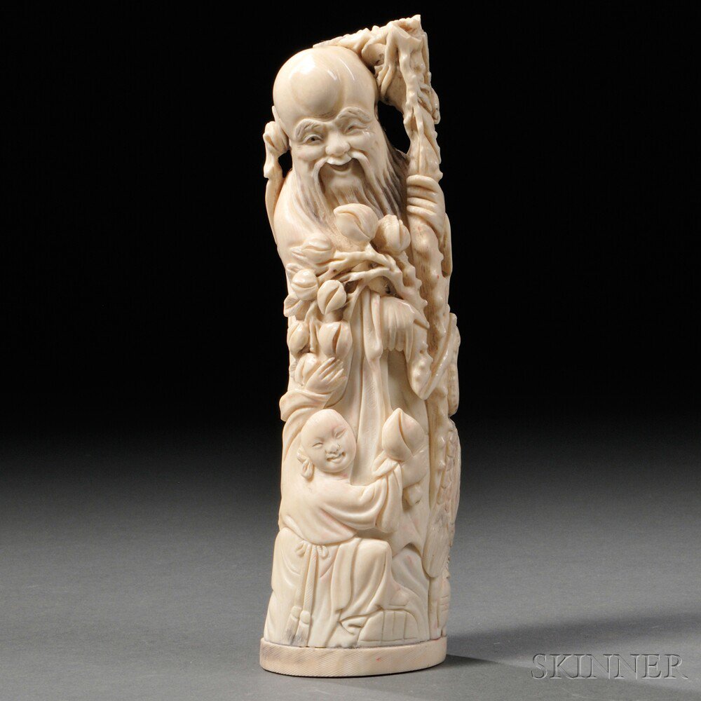 Appraisal: Ivory Carving of Shoulao China th century holding a wooden