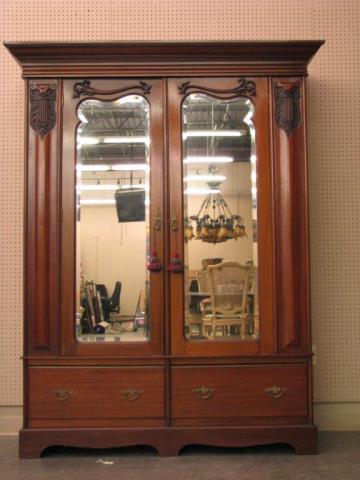 Appraisal: An English Victorian mahogany armoire with two mirrored doors and