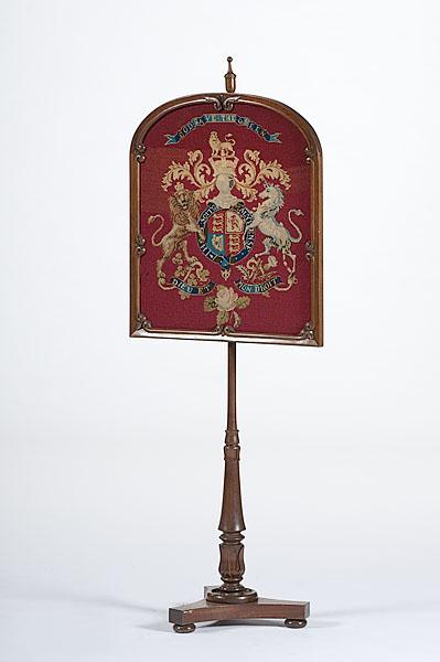 Appraisal: VICTORIAN FIRE SCREEN English ca with a large mahogany shield-shaped