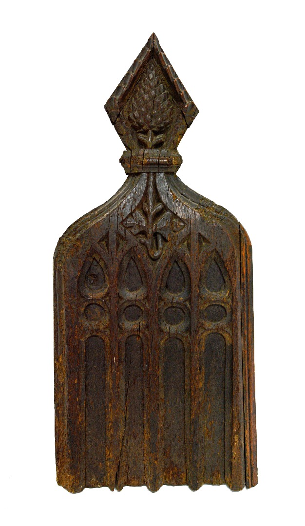 Appraisal: A large carved oak pew end with diamond surrounded thistle