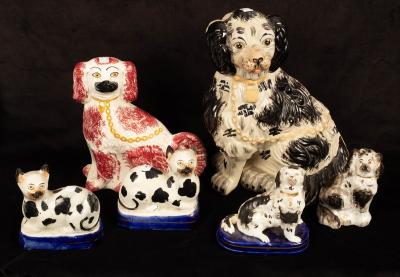 Appraisal: Four Staffordshire figures of seated spaniels and a pair of