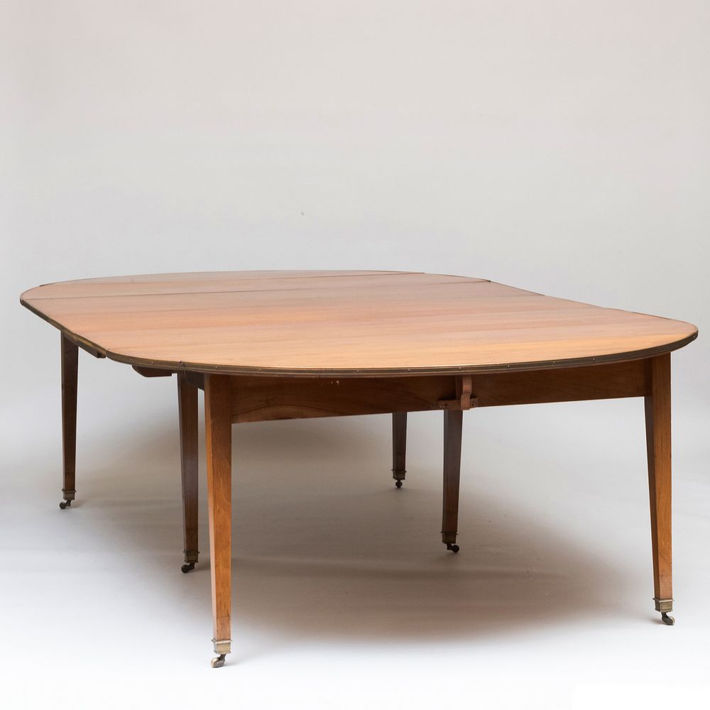 Appraisal: Directoire Brass-Mounted Walnut Extension Dining Table With four leaves each