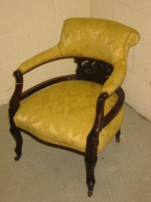 Appraisal: A LATE VICTORIAN WALNUT FRAMED ARM CHAIR of tub form