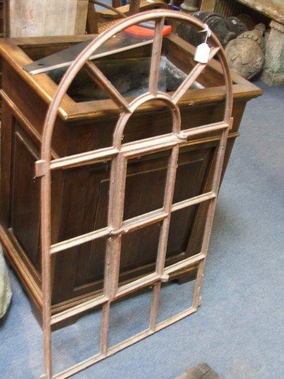 Appraisal: AN IRON WINDOW FRAME with arched fan top and opening