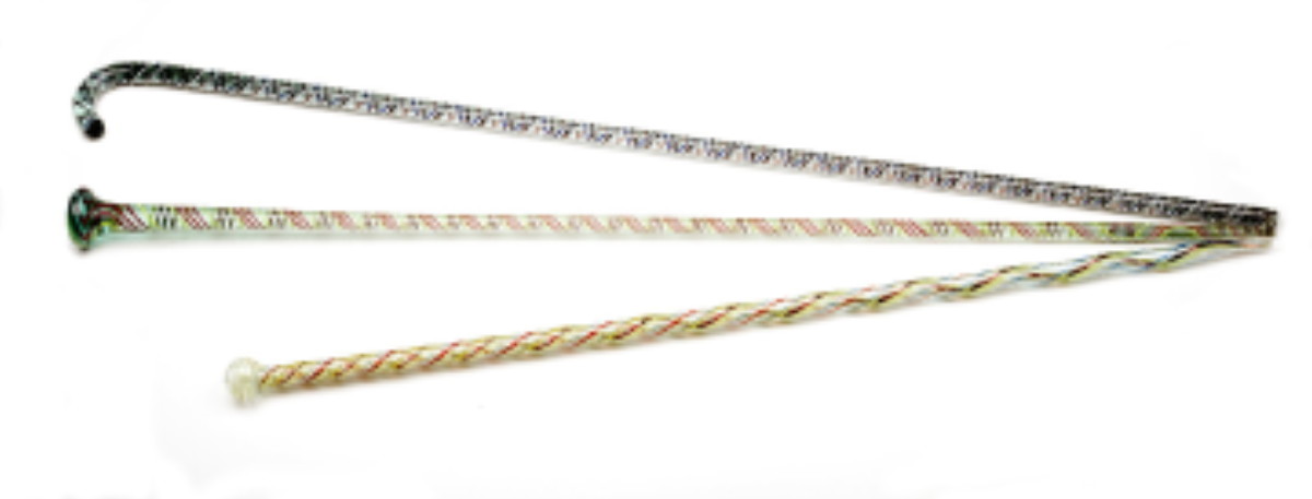 Appraisal: THREE BLOWN STRIPED GLASS BATON AND CANE WHIMSEYS Each tapered