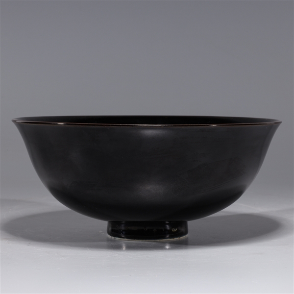 Appraisal: Chinese black glazed porcelain bowl with six-character Qianlong mark to