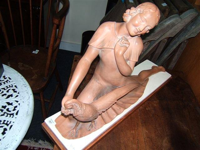 Appraisal: An Art Deco plaster figure of a lady and pheasant