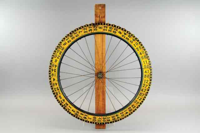 Appraisal: CARNIVAL AMUSEMENT WHEEL 's wooden wheel of fortune painted in