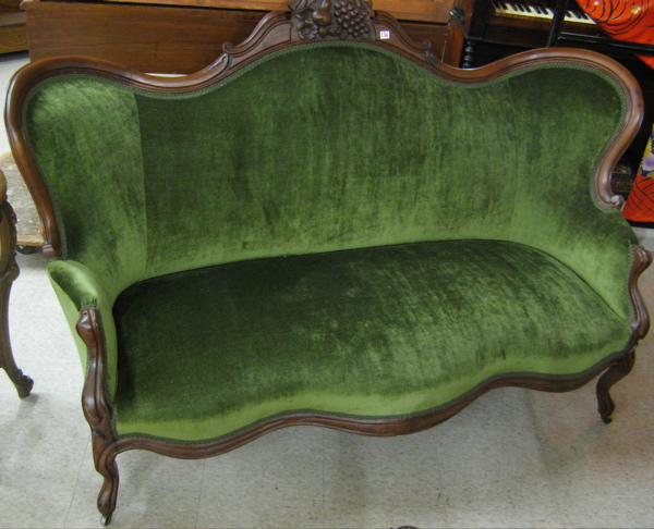 Appraisal: A VICTORIAN SERPENTINE-BACK WALNUT SOFA Rococo Revival American c -