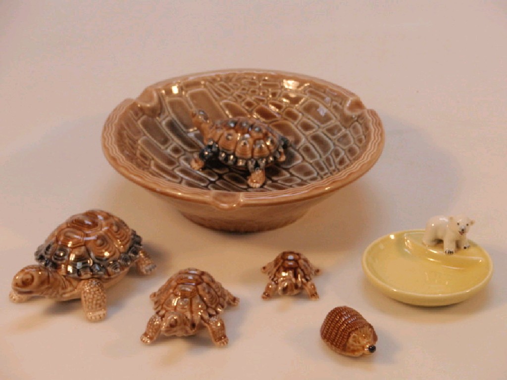 Appraisal: Three tortoiseshell Wade whimsies a Wade porcelain dish with tortoise