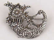 Appraisal: A white metal tests silver and marcasite brooch watch the