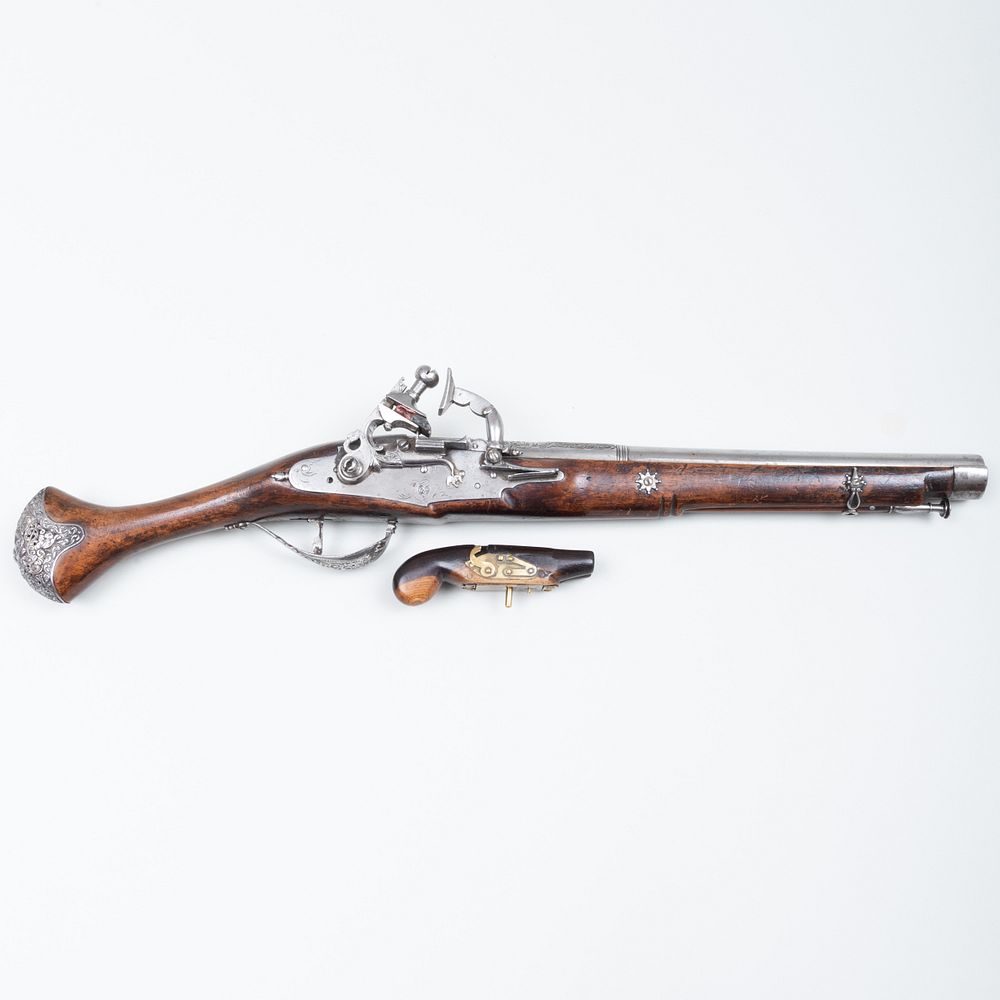 Appraisal: Silver Metal-Mounted Flint Lock Pistol and a Treen Pistol Form