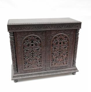 Appraisal: Burmese Two Ornately carved exotic wood server with pierce doors